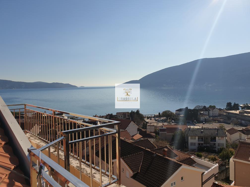 Modern penthouse with a private pool and sea view